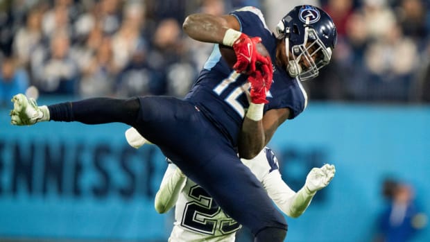 Tennessee Titans wide receiver Treylon Burks (16) pulls in a catch over Dallas Cowboys cornerback C.J. Goodwin (29) during the fourth quarter at Nissan Stadium Thursday, Dec. 29, 2022, in Nashville, Tenn.